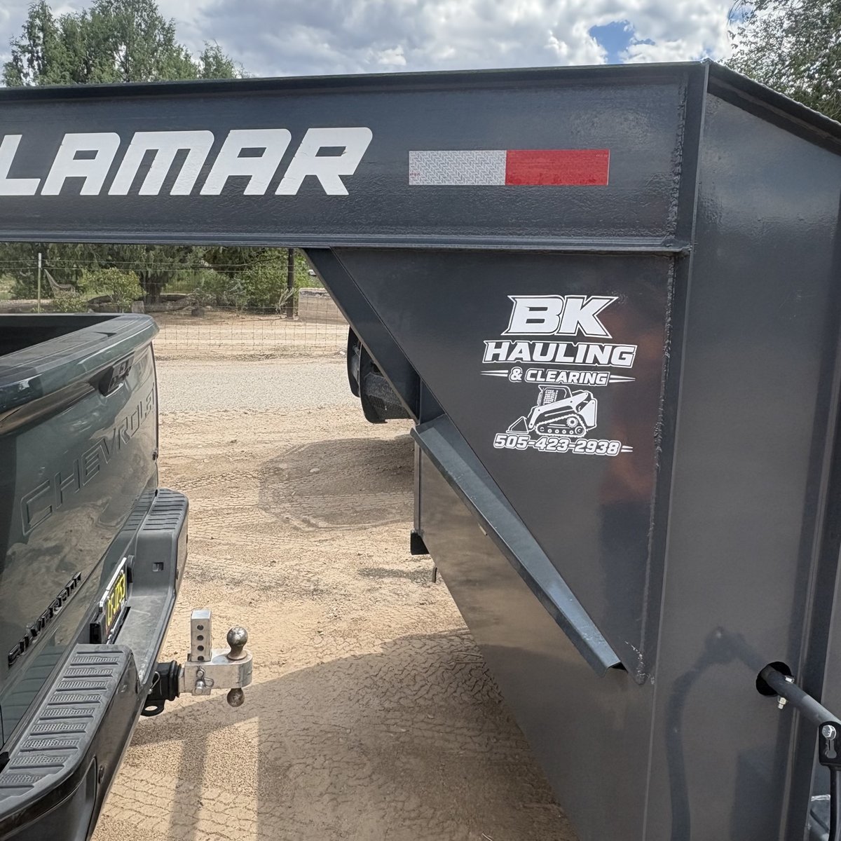 BK Hauling & Clearing vinyl decal applied to the dump trailer, made by KB Custom Creations