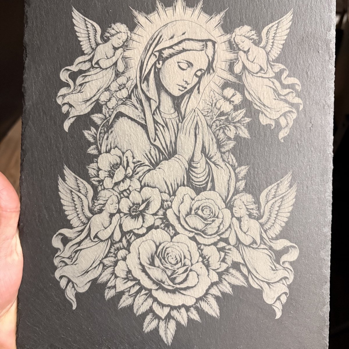 Laser-engraved slate artwork of the Virgin Mary with angels and roses by KB Custom Creations