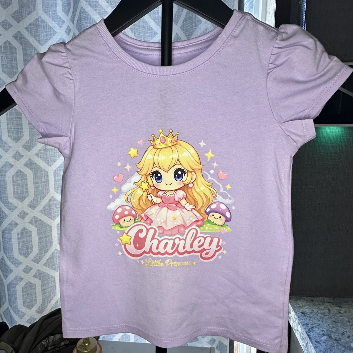 Lavender kids' t-shirt with a personalized princess design, made by KB Custom Creations