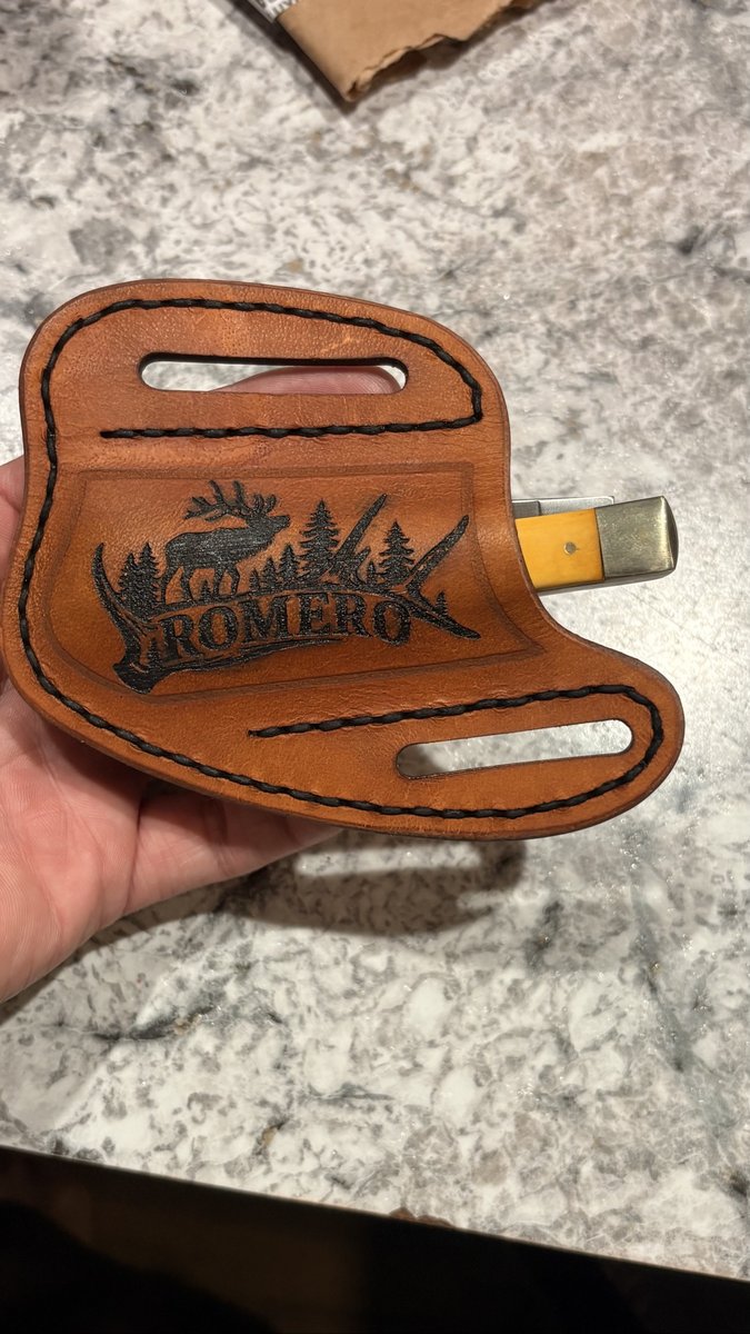 Tan leather knife sheath engraved with an elk and the name Romero by KB Custom Creations