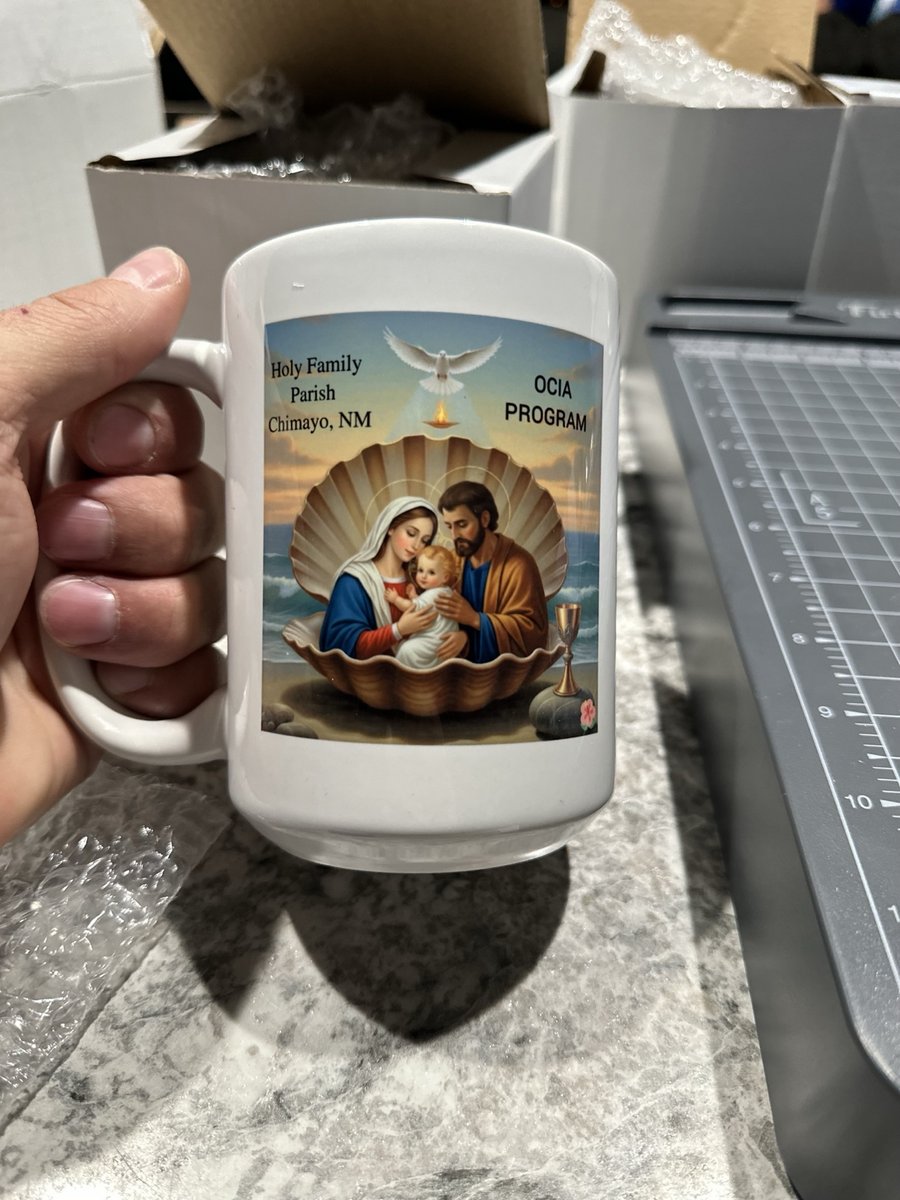 White mug printed with Holy Family artwork for a parish program in Chimayo, New Mexico, by KB Custom Creations